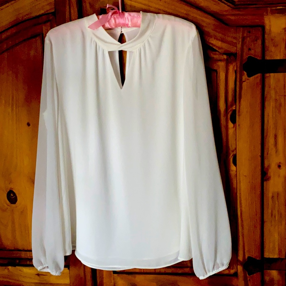 SIze 10 off white WHBM blouse. Bought it but never wore it.